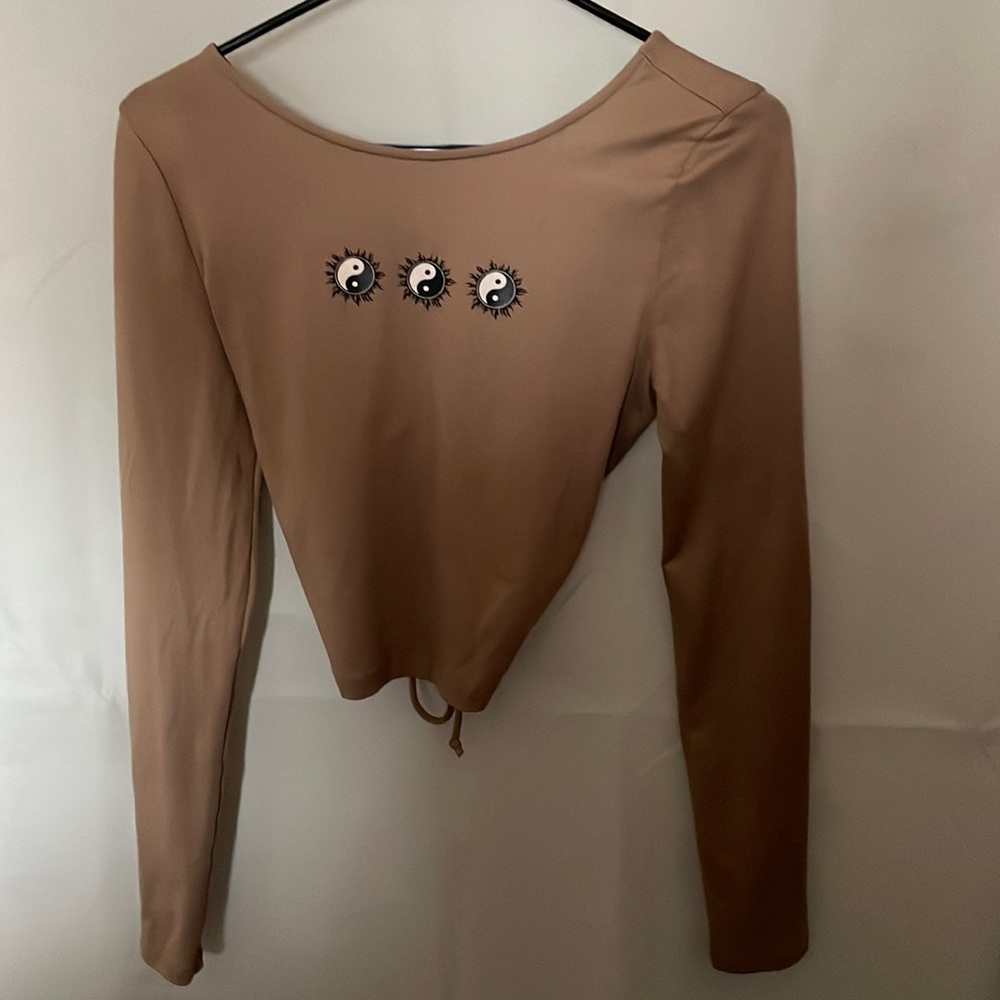 Brown long sleeve yin and yang symbol